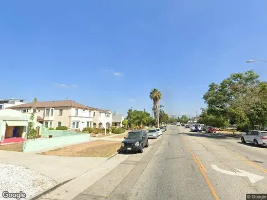 Street view of TDCLA - The Detox Center Los Angeles, a detox center in Los Angeles with palm trees and residential buildings.